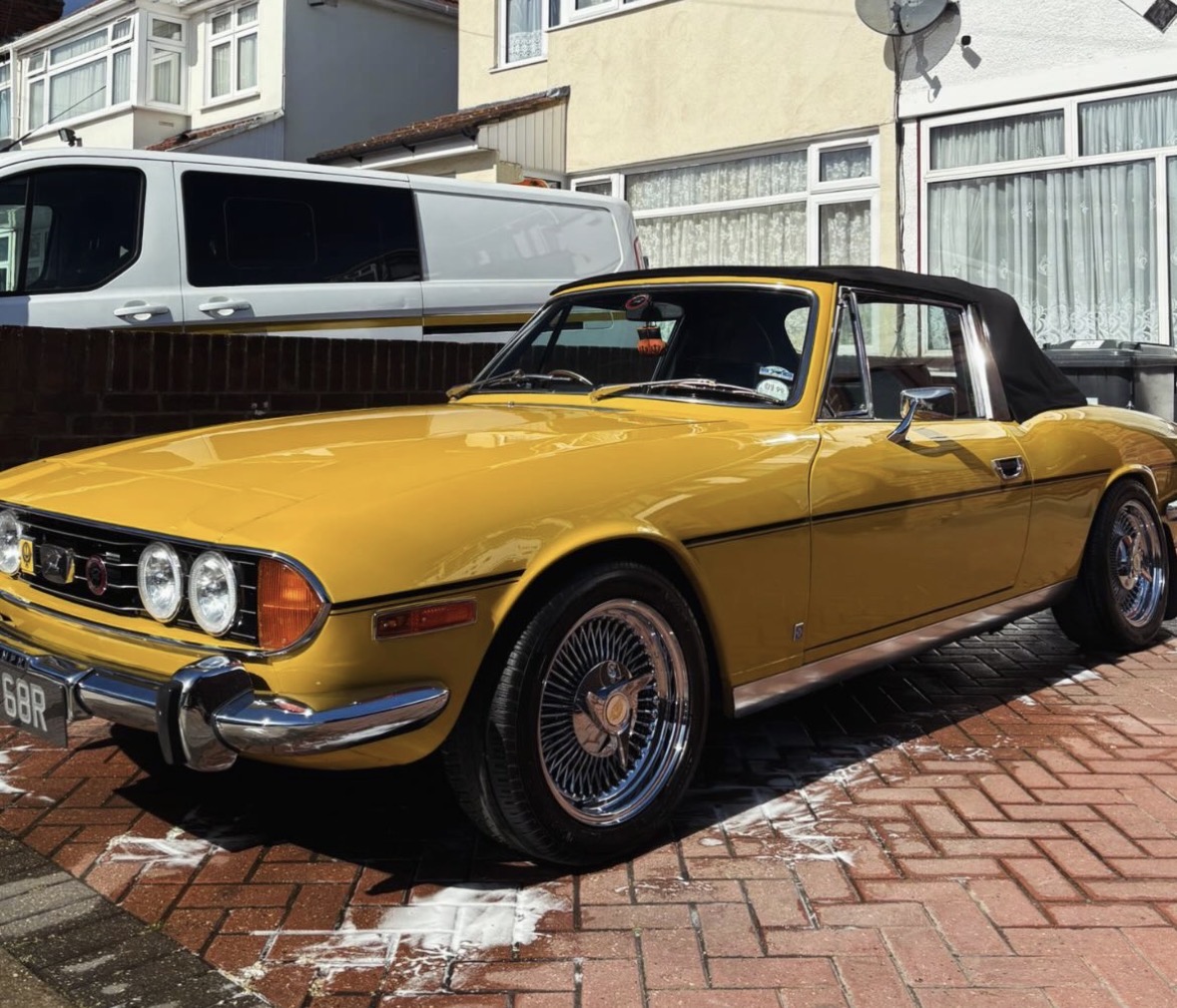 Classic yellow Triumph Stag convertible